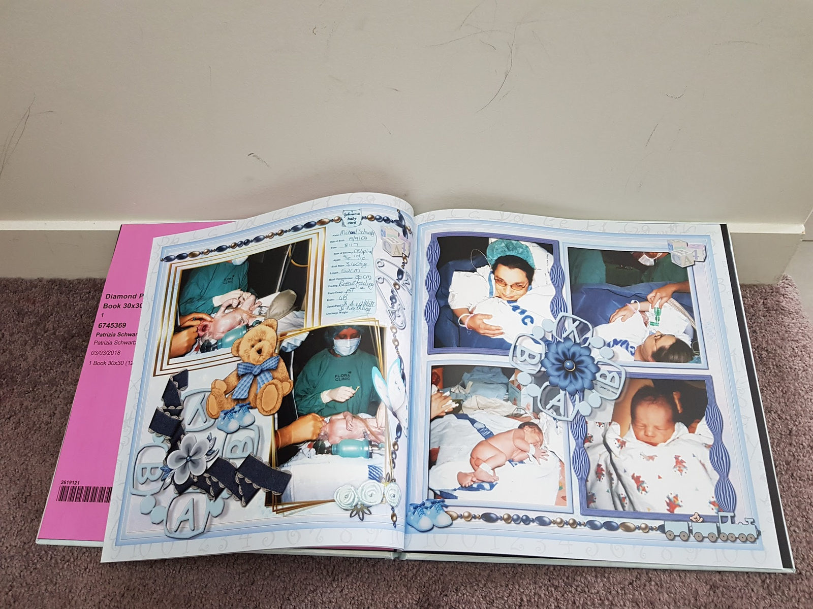 High angle view of a completed photo book resting on a wooden table